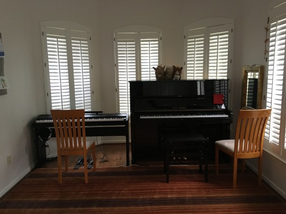 two pianos and plenty of room for movement, yet still cozy